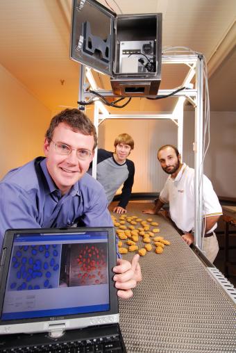 GTRI Researcher John Stewart led a project to evaluate infrared temperature sensing to control meat cooking, 2006.