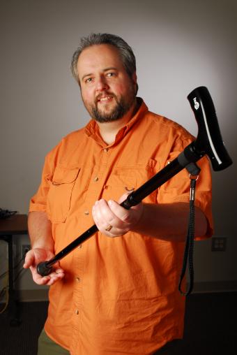 GTRI researcher Brad Fain holds the Hugo Folding Crane, 2007.