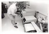 With a gas chromatograph, Dave Hurst determines the composition of gaseo...