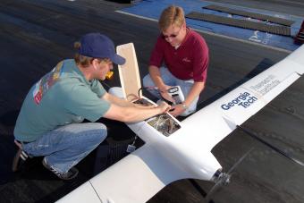 Graduate student Thomas Bradley and Aerospace Researcher Reid Thomas start up the fuel cell unmanned aerial vehicle during a test flight at the Atlanta Dragway, 2006.