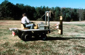 EES engineers adapted radar techniques initially developed for non-metallic mine detection to civilian applications. One version locates underground pipes. Another detects voids beneath pavement, 1983.