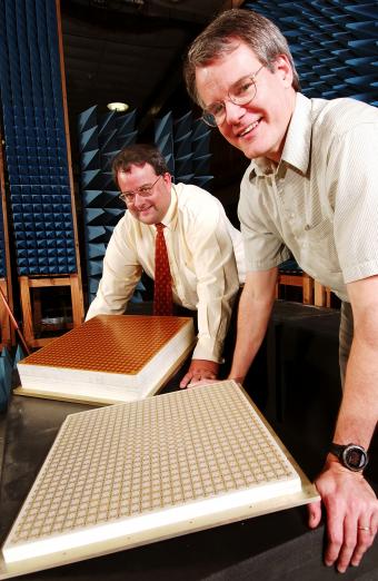 GTRI researchers James Maloney (left) and Paul Friederich display prototype panels of the ultra-wideband antenna, 2006.