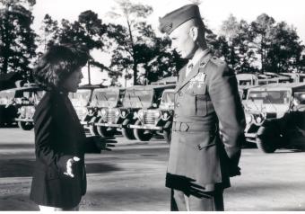 Judi Komaki of the Economic Development Lab discusses, with a battalion commander at Camp Lejeune, North Carolina, why vehicle maintenance is frequently neglected, 1981.