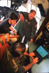 Operators demonstrate FalconViewTM aboard a C-130 aircraft parked at Dob...
