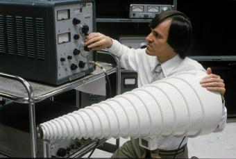EES electromagnetic compatibility specialists use an antenna to study radio signal penetration of buildings, 1981.